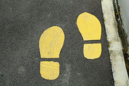 yellow Footprints On Foot Pathの写真素材