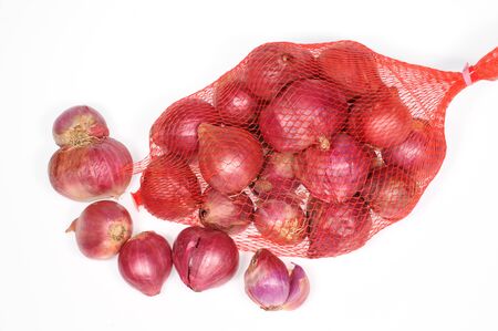 A Bag Of Red Onions With Isolated Backgroundの写真素材