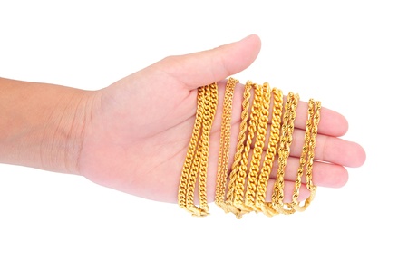 Hand Holding Gold Jewelryの写真素材