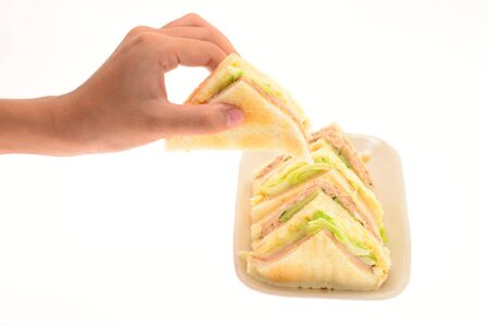 Hand Picking Up Sandwichの写真素材