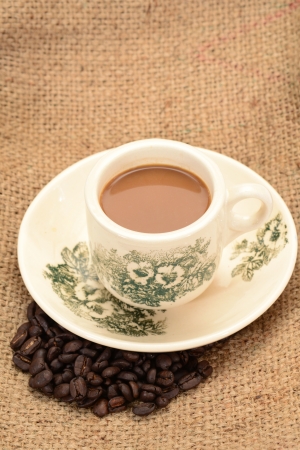 A Cup Of Coffee With Coffee Seedsの写真素材