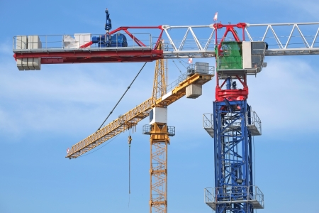 Closeup Of Tower Cranes At A Construction Siteの写真素材