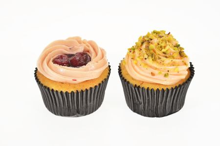 Colorful Mini Cup Cakes With Fruit Cream Topping, Side Viewの写真素材