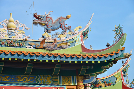 Kirin And Phoenix Statues On The Roof Of A Chinese Templeの写真素材