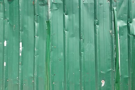 Green Color Corrugated Metal Sheets Forming A Backgroundの写真素材