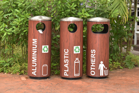 Recycle Bins At A Park For Collection Of  Different Materialsの写真素材