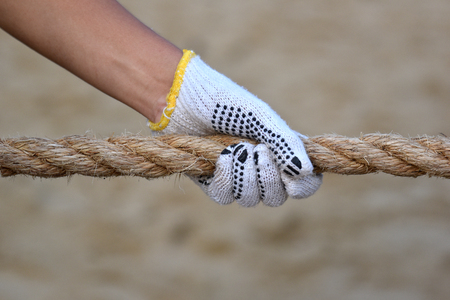 Hand Grabbing On Rope In Tug Of Warの写真素材