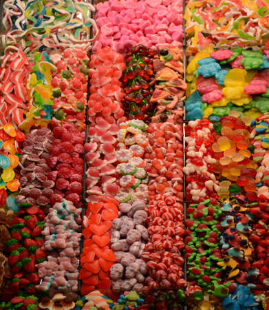 Multicolored sweets on the market counterの写真素材