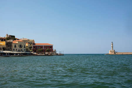 Greece, Chania - August 09, 2018: Venetian Harbor and lighthouse of Chania Old Town. Crete island of Greeceのeditorial素材