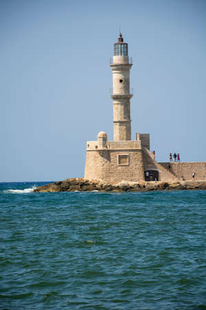 Greece, Chania - August 09, 2018: Lighthouse in the Venetian Harbor in Chania Old Town. Crete island of Greeceのeditorial素材