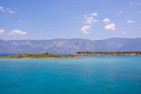 Aegean Islands on mountains and blue sky background, Turkey. Tropical wallpaper, paradise beachの写真素材