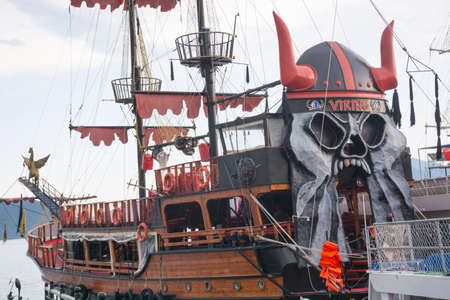 Turkey, Marmaris - June 20, 2019. Viking pirate yacht parking in the sea at sunset in the background of the mountains in Marmaris bay, Turkeyのeditorial素材