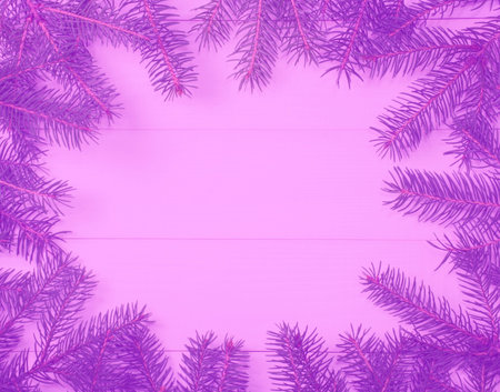 Christmas tree frame branches on wooden purple toned blurred background with copy space. Horizontal...