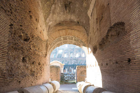 Colosseum arch and ruins of columns in Rome roman amphitheater, Italy. Main italian landmarkの写真素材