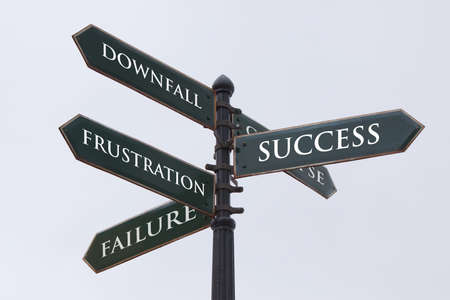 Directions road sign for success failure frustration and downfallの写真素材
