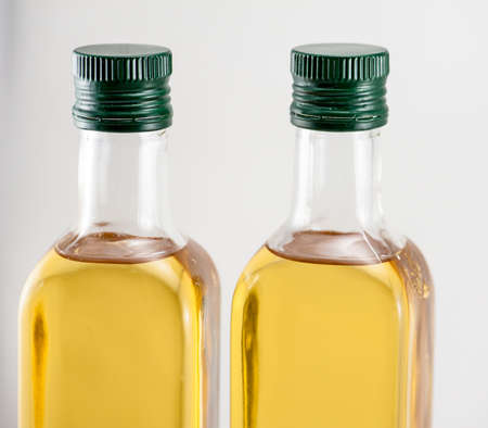 Two standing bottle of walnut oil on the white backgroundの写真素材