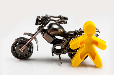 A motorcycle model and a yellow carton personの写真素材