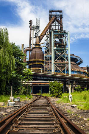 Rusted railway and abandoned steel works in outsideのeditorial素材