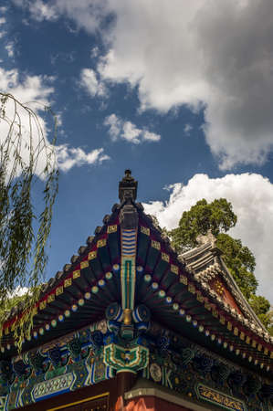 Traditional eaves at the Chinese building against sunshineの写真素材