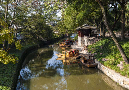 Some boats parked at the riverside in Suzhouの写真素材