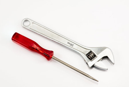Spanner and a screwdriver on the white background