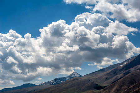 Cloudscape and mountainsの写真素材
