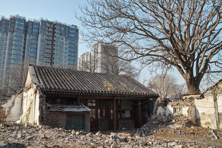 Demolished old house and the new residential buildingの写真素材