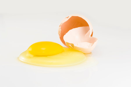 Broken egg isolated on white
