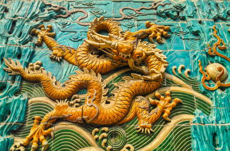 The dragon sculpture on Nine Dragon Screen of Beihai park, Beijingのeditorial素材