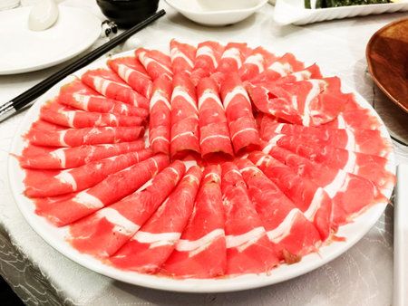 Sliced mutton for hot pot,  a very popular Chinese dish,especially in Beijing,and is primarily eaten in winterの写真素材