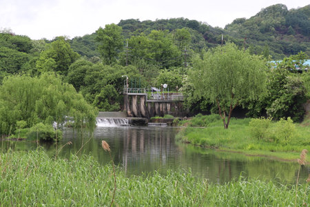 Landscape view of a dam in the middle of a river.の写真素材