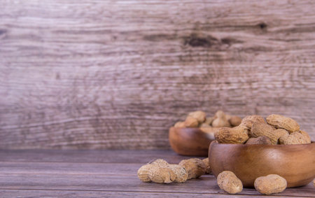 Peanuts on the wood backgroundの写真素材