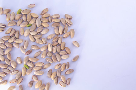 Pistachio nuts - Isolated on a white background.