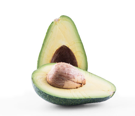Two slices of avocado isolated on the white background
