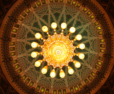 MUSCAT, OMAN - MAY 10, 2016: Crystal chandelier inside Sultan Qaboos Grand Mosqueのeditorial素材