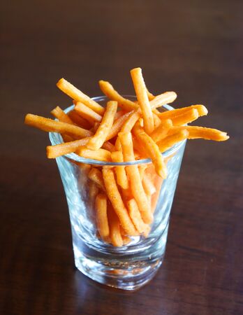 Chicken leg bread sticks in a glassの写真素材