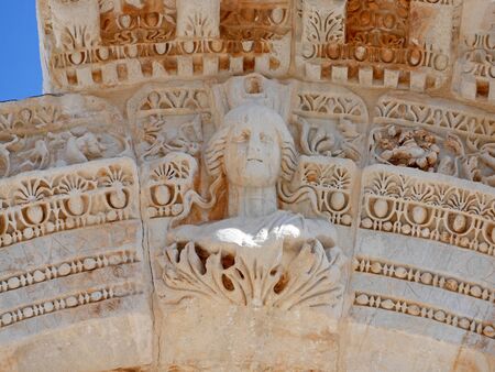 Statue on the entrance gate of Temple of Hadrian ruins inÂ Ephesus, Turkeyの写真素材
