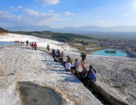 PAMUKKALE, TURKEY - March 7, 2017: Tourists taking foot bath in a water channelのeditorial素材