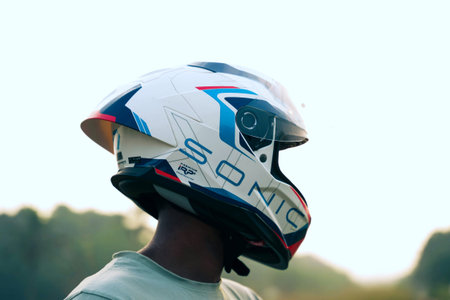 Rear view of a man wearing a helmet