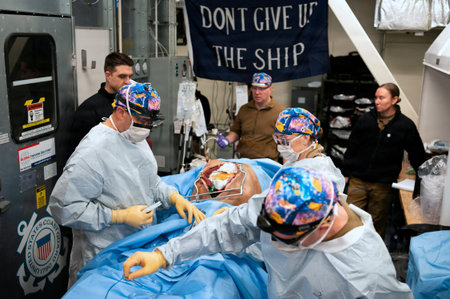 Group of surgeons performing operation on a patient in a hospital.