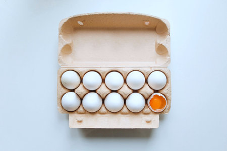 Eggs in a cardboard box on a white background.