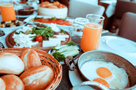 Breakfast with fried eggs, bread and vegetables in a basket on the table