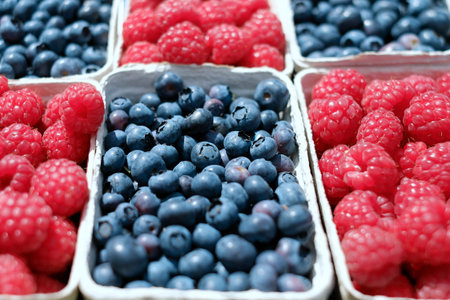 Blueberries and raspberries in a box, close-up