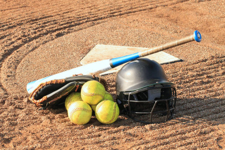Baseball equipment on a baseball field in a sunny day, closeup of photo