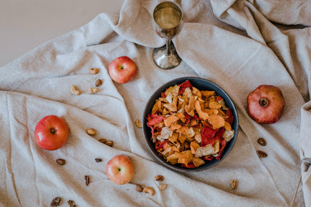 Healthy breakfast bowl with granola, apples and pomegranate