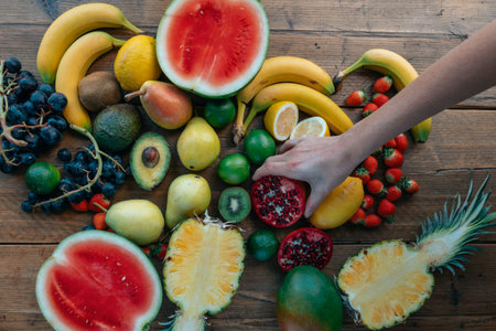 Fruits and vegetables on a wooden table. Top view. Flat lay.