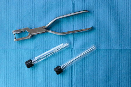 Surgeon's tools on blue background. Top view. Copyspace.