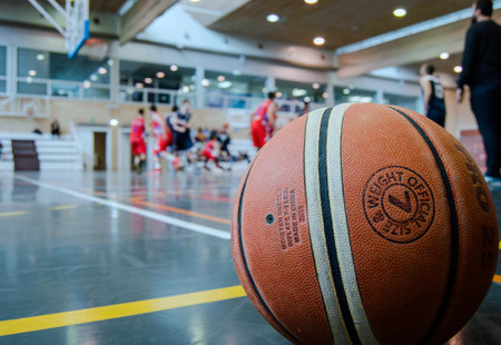 Basketball ball in basketball court. Sports background. Close-up.