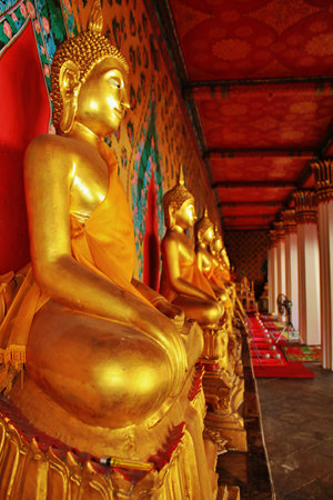 Wat Arun or Wat Chaeng In the gallery of  the main chapel, there are 120 stuccoed Buddha image in the attitude of  subduing Mara ,the evil spirit. Thailandのeditorial素材