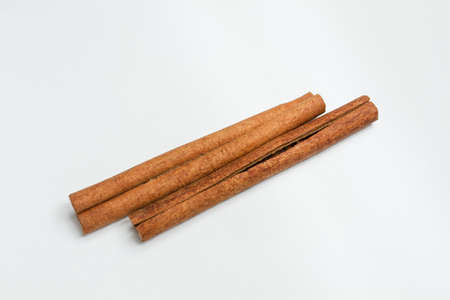 cinnamon stick on white isolated backgroundの写真素材